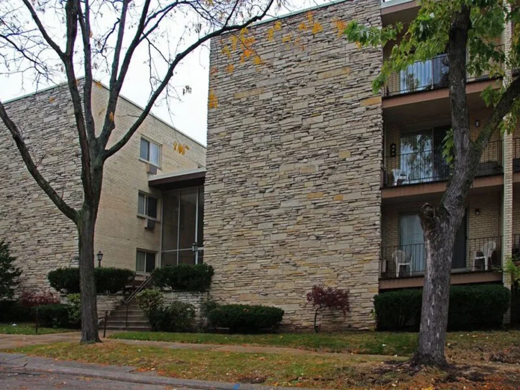A building with a tree in front of it