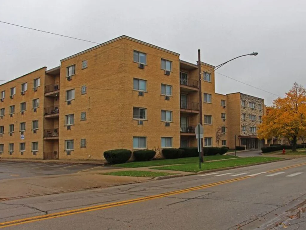 A large apartment building with many windows and balconies.